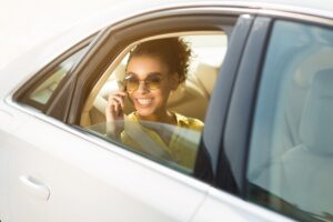girl-chatting-on-cellphone-having-fun-during-luxury-taxi-ride.jpg